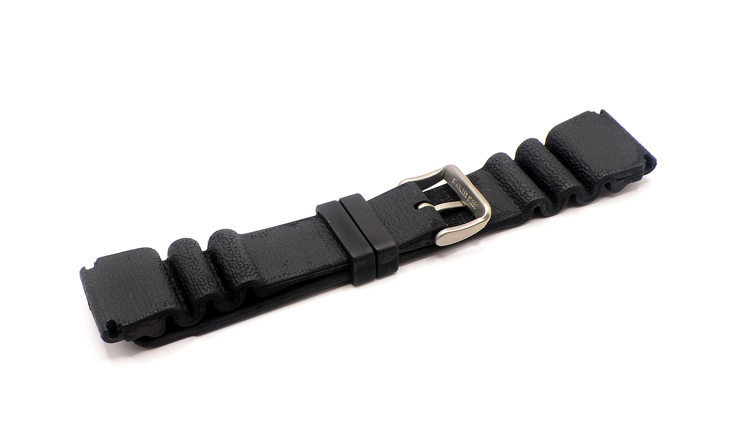 A black rubber watch strap with a stainless steel buckle, rolled and secured in a neat position. The strap is 24mm wide and designed for durability and comfort.