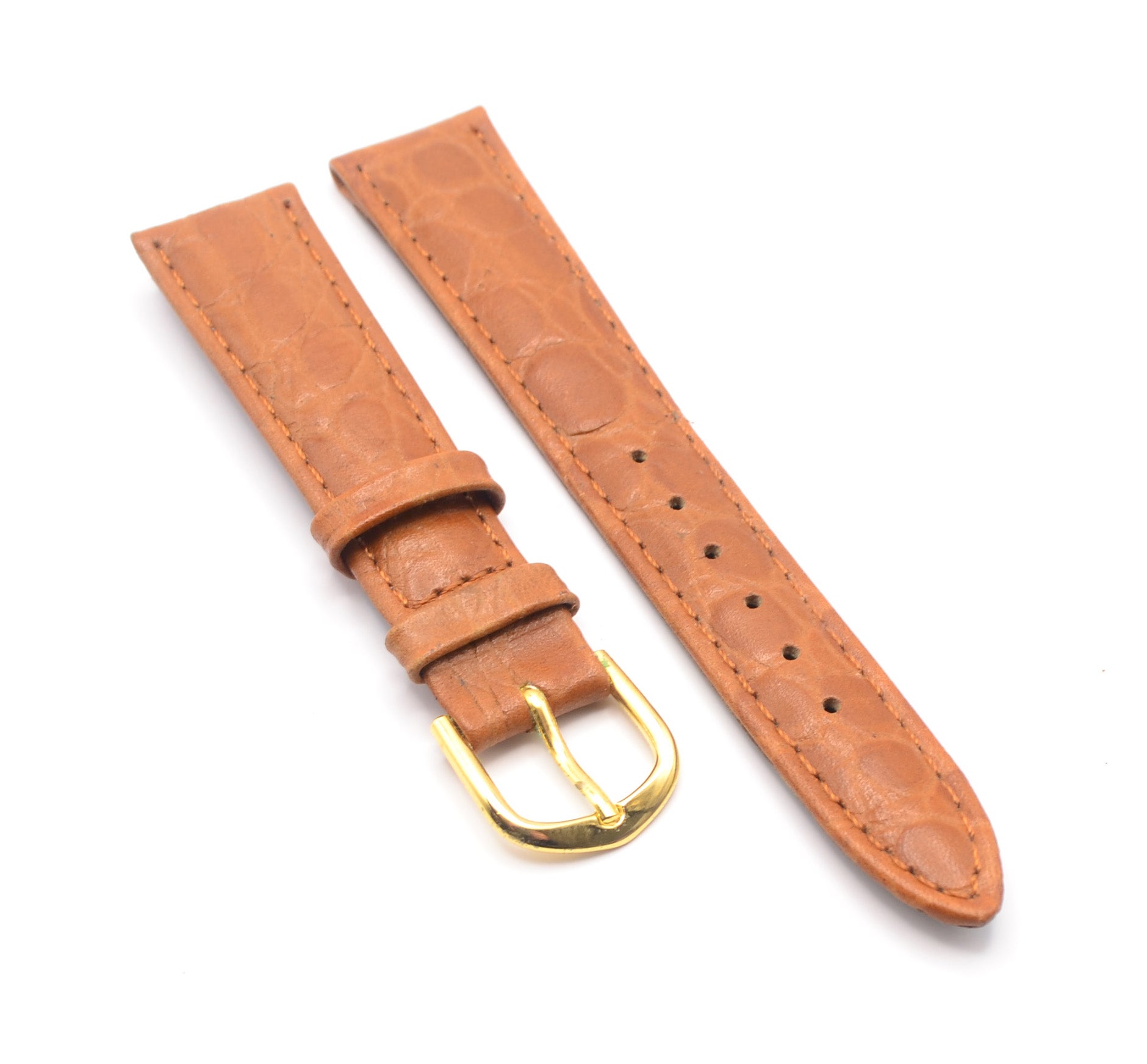 Two-piece tan leather watch strap, top and buckle side.