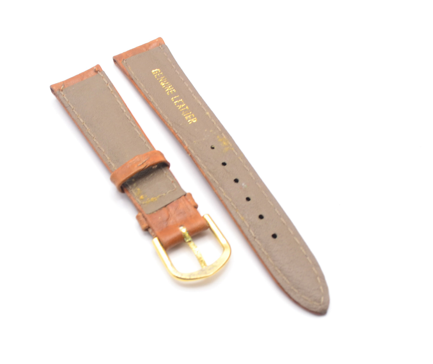 Tan leather watch strap showing genuine leather text on the underside.