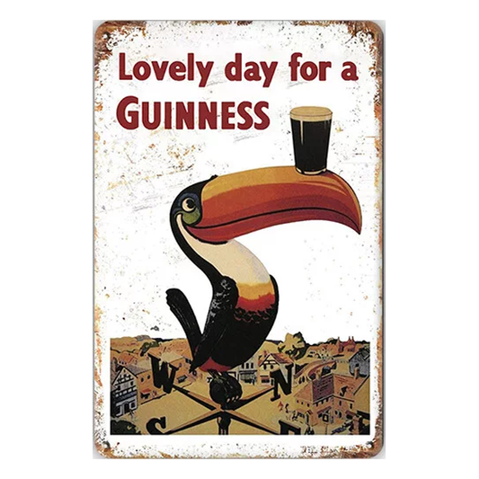 Lovely Day for a Guinness retro metal sign featuring the iconic toucan with a pint of Guinness, perfect for home bars, pubs, or man caves.