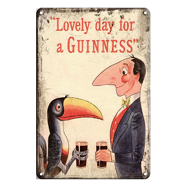 Retro metal sign featuring the "Lovely Day for a Guinness" slogan with a gentleman and toucan sharing a pint. Perfect for home bars or pubs.