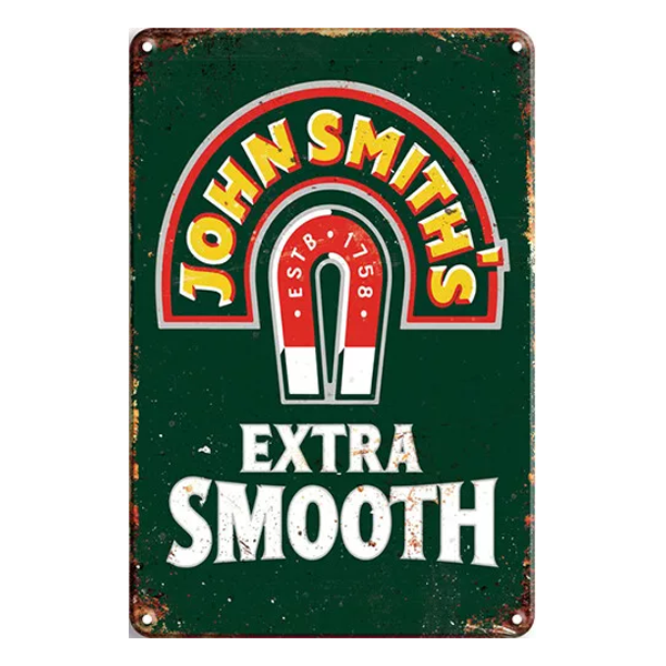 Vintage John Smith's Extra Smooth aluminium sign featuring the iconic horseshoe logo and a distressed design on a green background. Perfect for home bars and pubs.