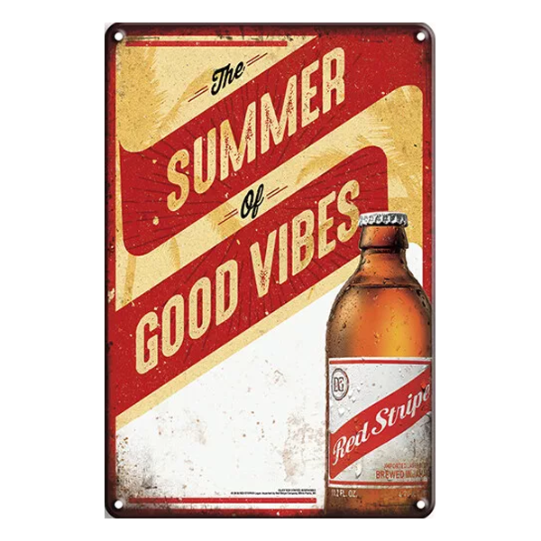 Red Stripe Summer of Good Vibes retro aluminium wall sign with vibrant yellow and red design, featuring a beer bottle and summer-themed text.