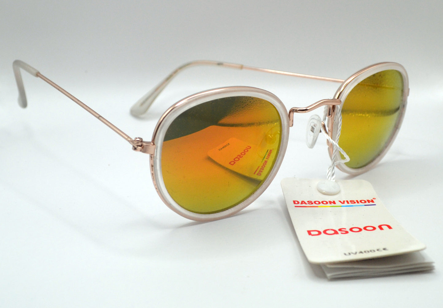 Close-up of round mirrored sunglasses with a rose gold frame and yellow-orange reflective lenses, labeled "Dasoon Vision" with UV400 protection tag attached.