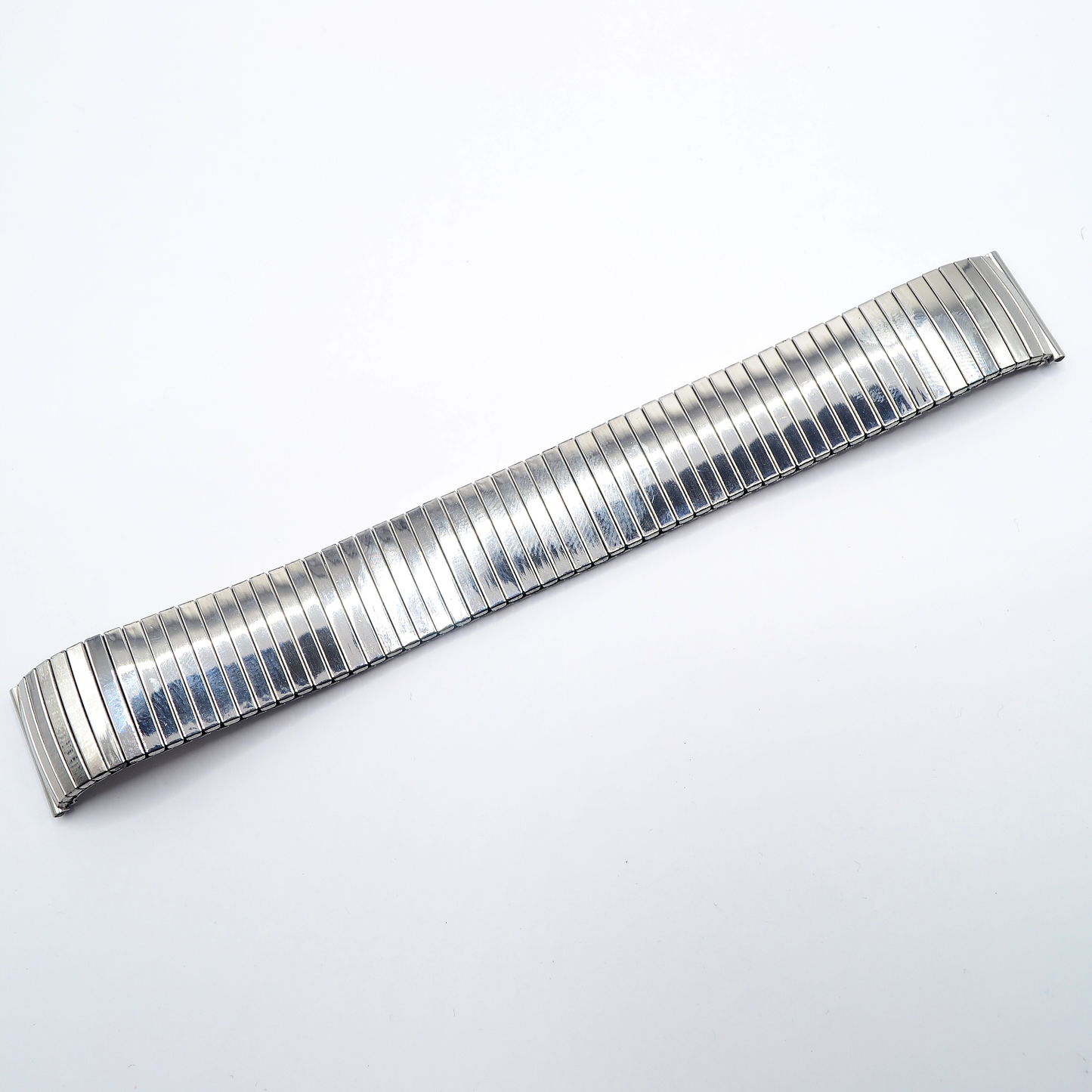 Stainless steel expander watch bracelet with mirror finish - full extended view.