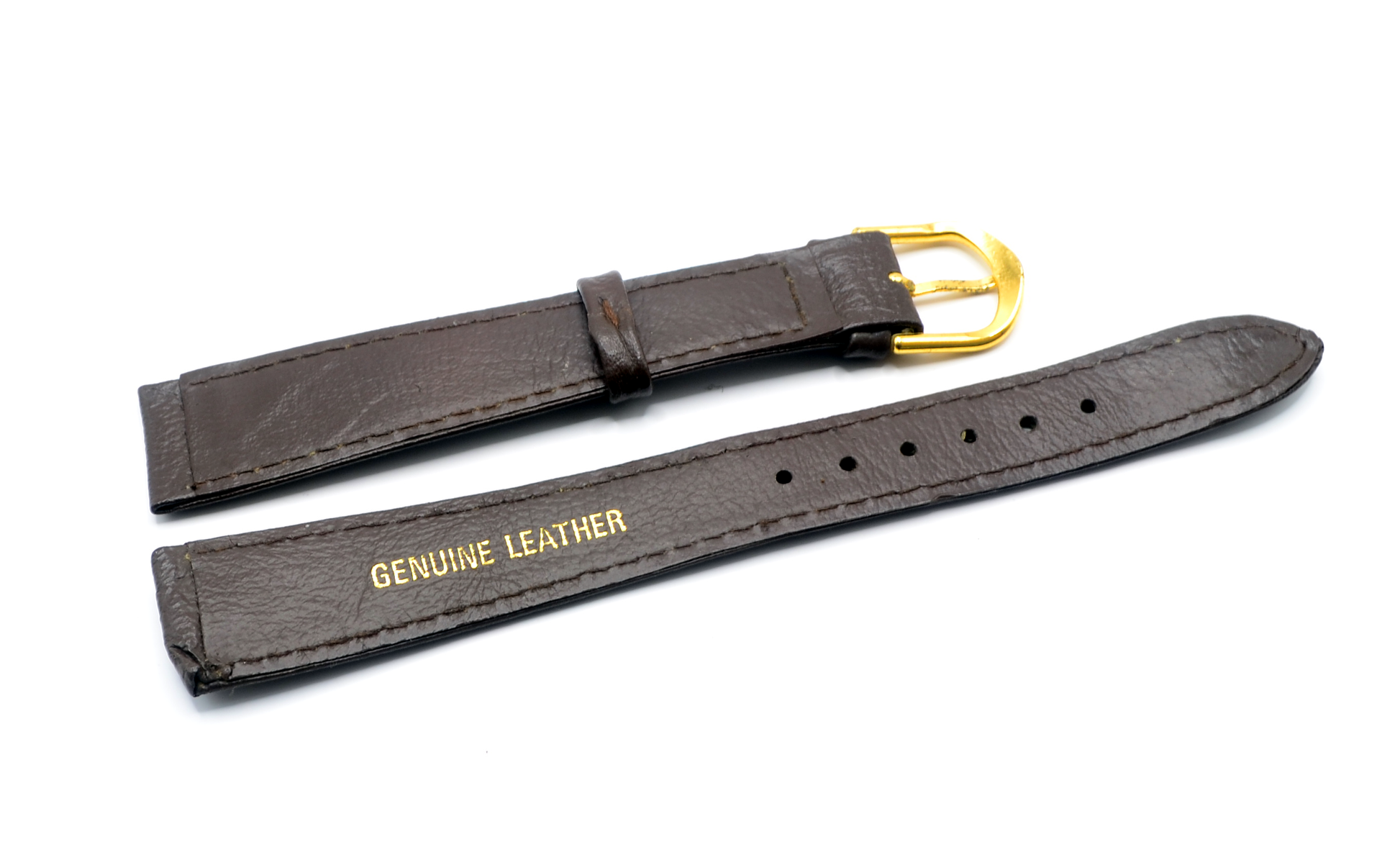 Underside of a brown genuine leather watch strap with "Genuine Leather" embossed in gold text. The polished gold-plated buckle is visible, and the strap is designed for an 18mm lug width.