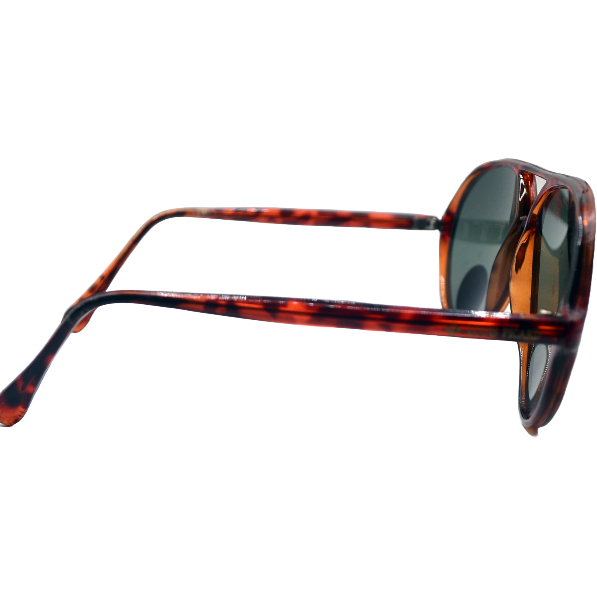 Close-up side view of brown tortoiseshell sunglasses with green lenses. The image highlights the curved temples and the rich, patterned design of the frames, showcasing the sunglasses' classic and stylish appearance.